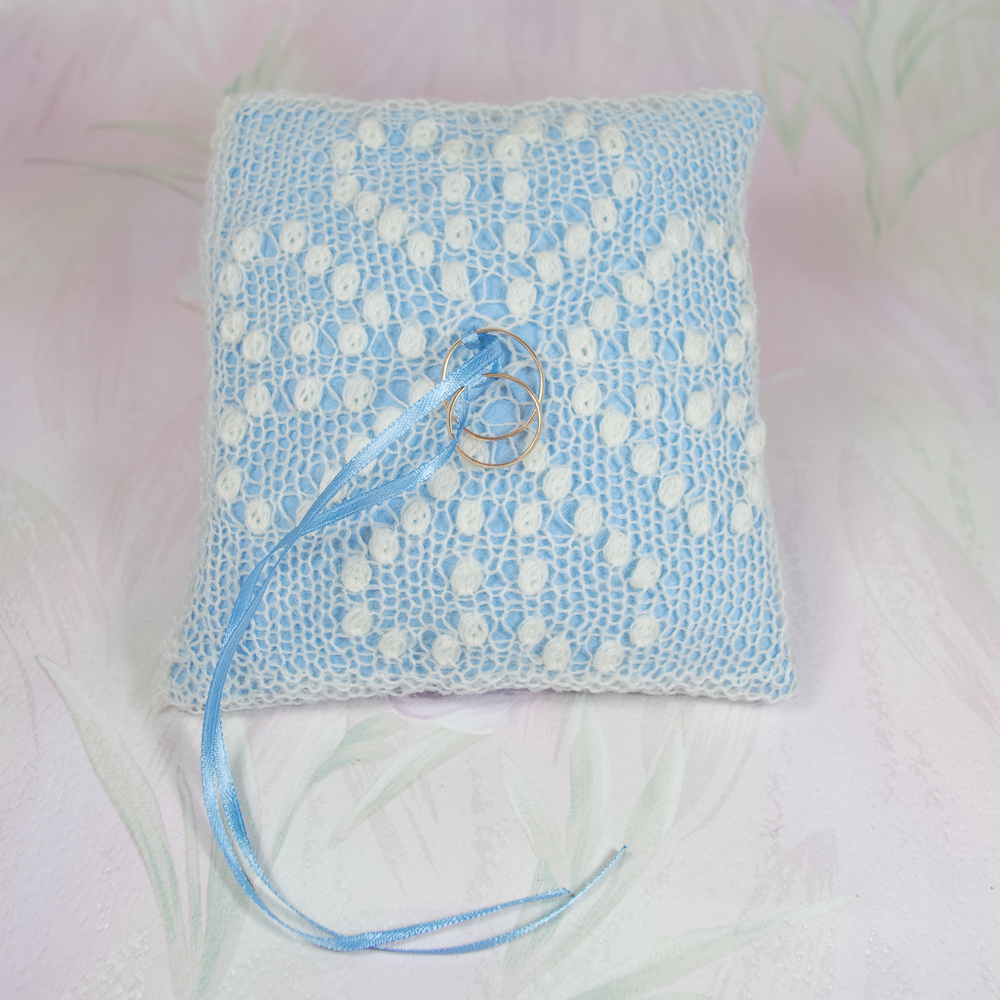 White ring cushion with Greta Garbo Pattern and light blue pillow by Artanis Wedding Lace