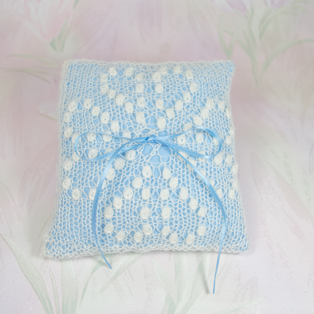 White ring cushion with Greta Garbo Pattern and light blue pillow by Artanis Wedding Lace